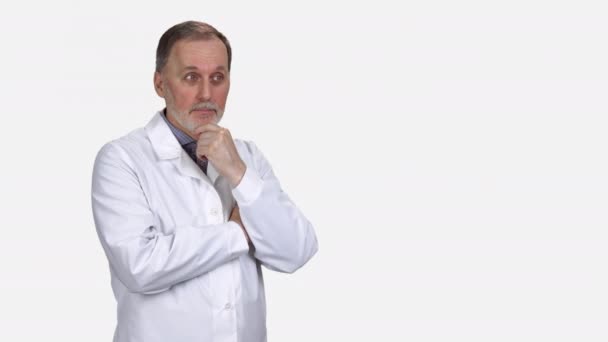 Portrait Senior Doctor Pointing Showing Copy Space Isolated White — Stock Video