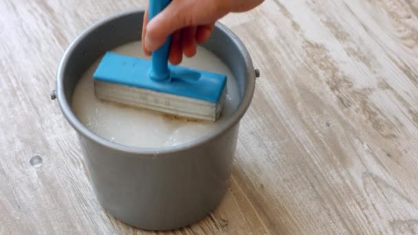 Wallpaper Glue Preparation Construction Glue Bucket — Stock Video