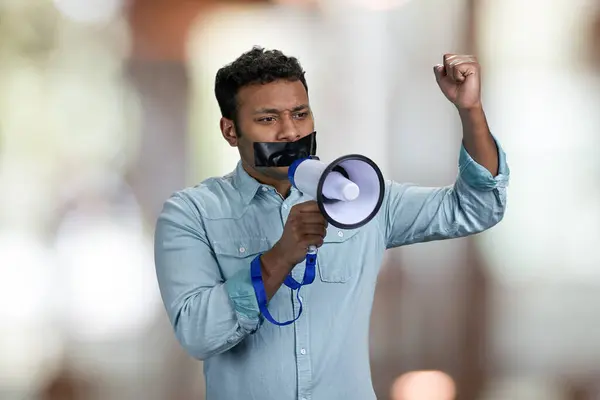 Young Man Acivist Taped Mouth Trying Speak Megaphone Abstract Bokeh — Stock Photo, Image