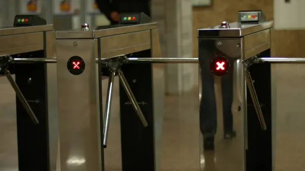 stock image Turnstiles in the subway. People pass through the turnstiles. Check point.