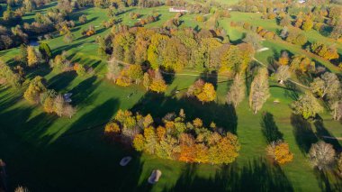 Aerial View of Mullingar golf course in Ireland on a sunny Autumn day, with long shadows and colors of autumn.