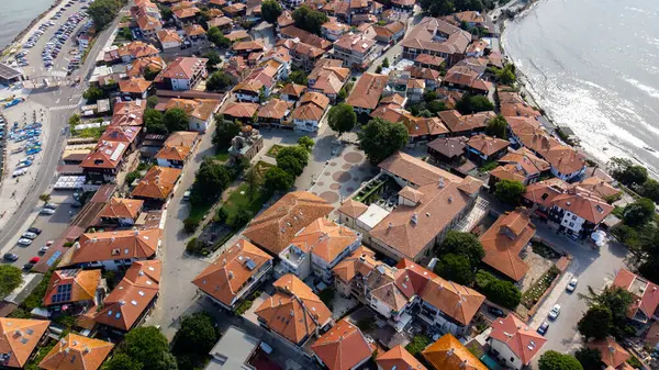 Top view Aerial view of the tile roofs of old Nessebar and parking place, ancient city on the Black Sea coast of Bulgaria, UNESCO World Heritage
