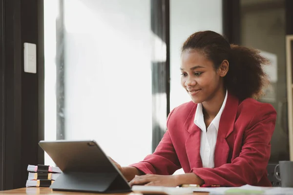 American woman sits in the office of a startup company, she is a company employee, young generation operations run the company with the concept of the new generation. Company management concept