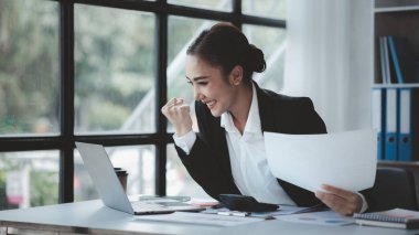 Beautiful Asian woman is a businesswoman who leads a new generation of startups, a woman who runs and manages a business plan to build confidence and stability in business, woman-led business concept.
