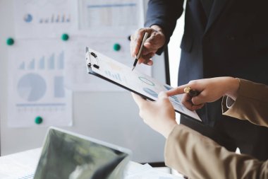 Group business people are having a meeting and planning their business together in the conference room, leaders of startup companies share their opinions and discuss how to run a successful business.