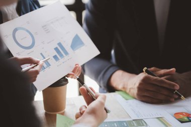 Group business people are having a meeting and planning their business together in the conference room, leaders of startup companies share their opinions and discuss how to run a successful business.