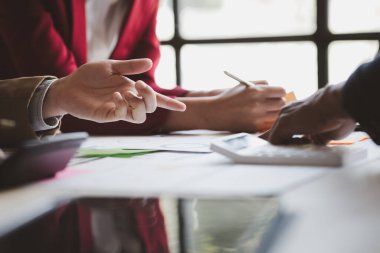Group business people are having a meeting and planning their business together in the conference room, leaders of startup companies share their opinions and discuss how to run a successful business.