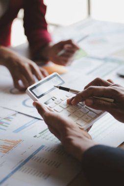 Group business people are having a meeting and planning their business together in the conference room, leaders of startup companies share their opinions and discuss how to run a successful business.