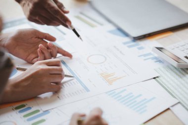 Group business people are having a meeting and planning their business together in the conference room, leaders of startup companies share their opinions and discuss how to run a successful business.