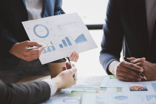 Group business people are having a meeting and planning their business together in the conference room, leaders of startup companies share their opinions and discuss how to run a successful business.