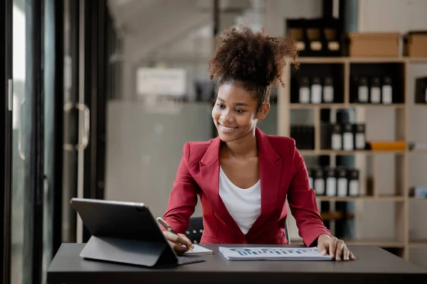 American woman sits in the office of a startup company, she is a company employee, young generation operations run the company with the concept of the new generation. Company management concept