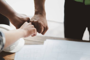 Architects and engineers are working together to edit the draft house plan that was designed after it was presented to the client and partially revised the design. Interior design and decoration ideas