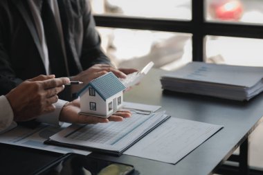 Meetings between the sales department and executives, they are brainstorming and planning the sales and marketing for the sale of housing estates in the company's projects. Real estate trading concept