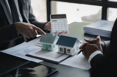 Meetings between the sales department and executives, they are brainstorming and planning the sales and marketing for the sale of housing estates in the company's projects. Real estate trading concept