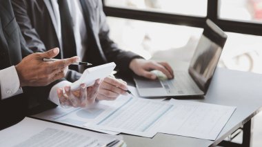 Group business people are having a meeting and planning their business together in the conference room, leaders of startup companies share their opinions and discuss how to run a successful business.