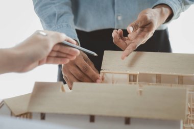 Architects and engineers are working together to edit the draft building plan that was designed after it was presented to the client and partially revised the design. Interior design and decoration ideas