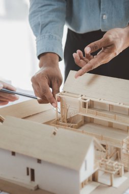 Architects and engineers are working together to edit the draft building plan that was designed after it was presented to the client and partially revised the design. Interior design and decoration ideas