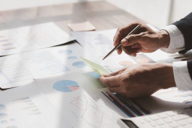 Businessman working, businessman looking at business documents and checking company finances, young startup company executive. Startup business management concept.