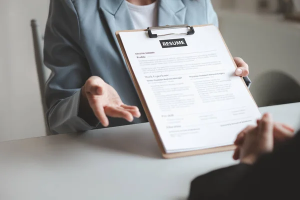 stock image Person submitting resume to interview for a job with a company, Person attending a job interview with a manager to be recruited to the company for the position applied for. Job application concept.