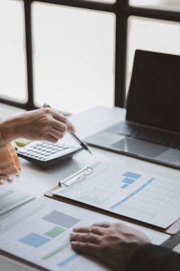 Business man group are meeting together in the office, they are meeting on the topic of finance and financial management, they are business partners. Concept financial management for startup companies