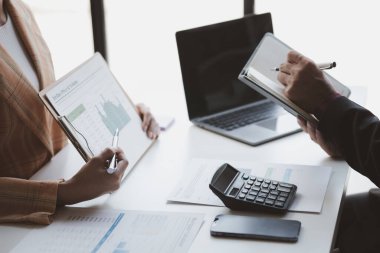 Business man group are meeting together in the office, they are meeting on the topic of finance and financial management, they are business partners. Concept financial management for startup companies