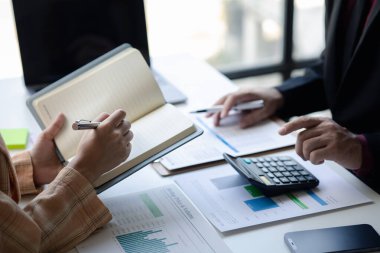 Business man group are meeting together in the office, they are meeting on the topic of finance and financial management, they are business partners. Concept financial management for startup companies