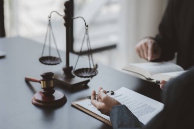 Attorneys or lawyers are advising clients in defamation cases, they are collecting evidence to bring charges against the parties for damages. The concept of defamation case counseling.