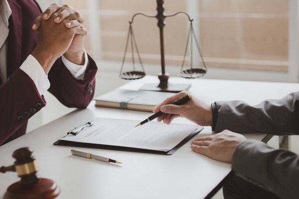 Attorneys advising in cases where a client has been defrauded by a defendant who is a business partner forming a joint company, advising on litigation and gathering evidence. Fraud case concept.