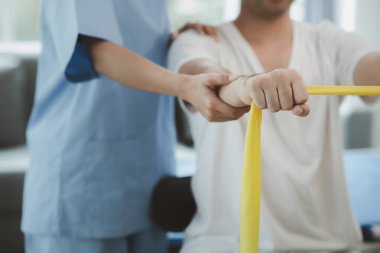 Physiotherapist is doing physical therapy for a patient, the patient has body aches due to overwork and has undergone treatment and physiotherapy with a professional physiotherapist.