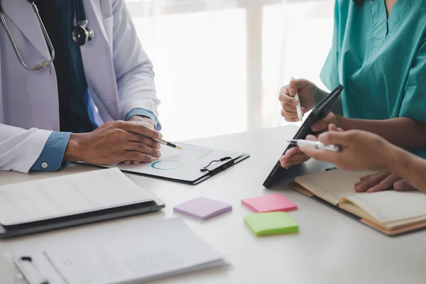 stock image A conference room in a hospital where a group of doctors are attending a meeting, a meeting of executive doctors and chiefs meeting with pharmaceutical dealers. Doctor meeting concept.