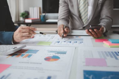 Atmosphere of a startup company meeting, business people are meeting together to summarize and plan investment finances, they are the founders of the company. Business administration concept.