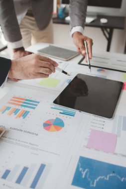 Atmosphere of a startup company meeting, business people are meeting together to summarize and plan investment finances, they are the founders of the company. Business administration concept.