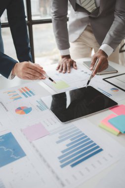 Atmosphere of a startup company meeting, business people are meeting together to summarize and plan investment finances, they are the founders of the company. Business administration concept.