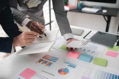 Atmosphere of a startup company meeting, business people are meeting together to summarize and plan investment finances, they are the founders of the company. Business administration concept.