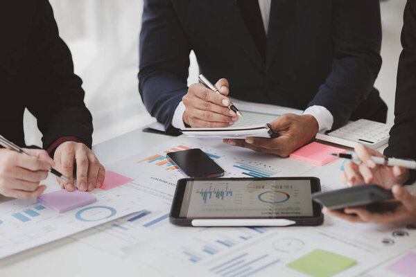 Atmosphere of a startup company meeting, business people are meeting together to summarize and plan investment finances, they are the founders of the company. Business administration concept.