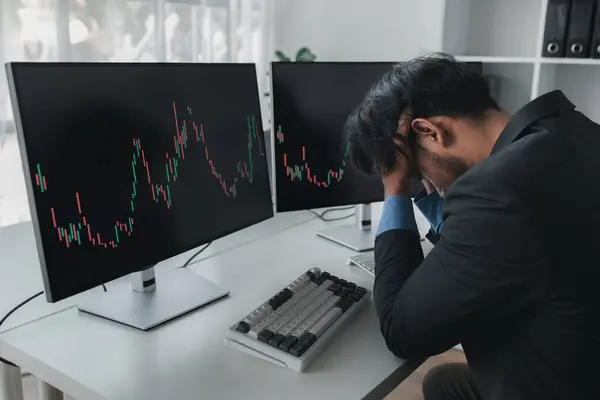 stock image Stock investor with stock market graph screen, he stressed, stock market volatility analysis, business man is trading stocks for profit, stock market volatility graph screen, profit trading analysis.