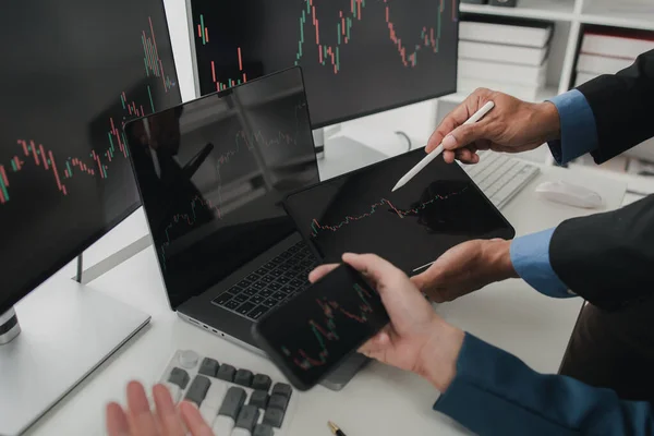 Two stock investors with stock market graph screen, stock fluctuation analysis, business man trading stocks for profit, stock market fluctuation graph screen, profit trading analysis.