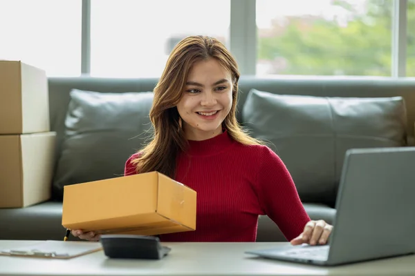 An online business owner, she sells products on a website and manages an online store on the Internet, taking orders and packing products for delivery to customers with a private courier service.