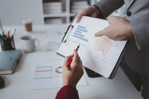 stock image Two businessmen are discussing analyzing company financial papers, operating and marketing planning meetings for a growing and profitable company. Business meeting concept.