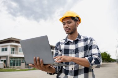 The home design architects are reviewing the house plan draft, the project commissioned by the client, and the custom design before delivery. Interior design and decoration ideas.