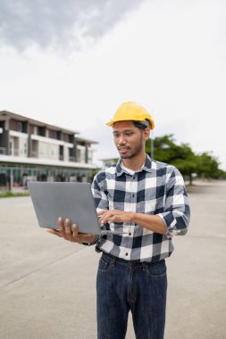 The home design architects are reviewing the house plan draft, the project commissioned by the client, and the custom design before delivery. Interior design and decoration ideas.