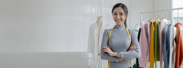 stock image Asian women own design and tailoring shops, women's clothing business owners, sell clothes online on websites and do live sales via social media. Business ideas for selling clothes and selling online.