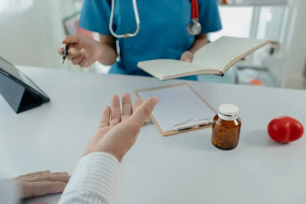 Doctors are giving advice on treatment to patients in hospital examination rooms, treating diseases from specialists and providing targeted treatment. Concepts of medical treatment and specialists.