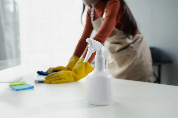 Cleaning staff wiping down office equipment, Wipe the keyboard clean with a towel and sanitizer, Wear rubber gloves when working with cleaning chemicals, cleaning idea.