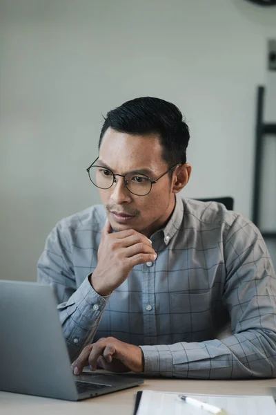 Businessman is stressed because of business problems in the office, worried about the company's problems, Thinking of solving the problem of stress from the loss of the company,
