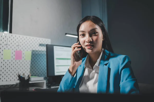 Beautiful woman in the office, happy, businesswoman uses internet phone close up, businesswoman checks email on smartphone, manager uses mobile phone, women in suit writes  message on smartphone