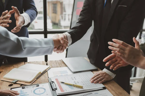 Make agreements with business partners, success in negotiating and entering into business contracts, handshake and meeting in teamwork, Shot of a businessman and businesswoman shaking hands,