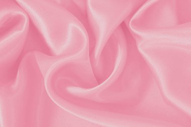 Yumuşak pembe kumaş dokusu arkaplanı, ipeğin veya keten deseninin ayrıntıları.