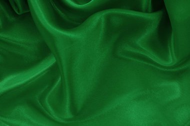 Green emerald fabric texture background, detail of silk or linen pattern.