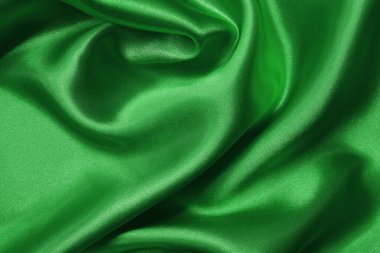Yeşil kumaş dokusu arkaplanı, ipeğin veya keten deseninin ayrıntıları.